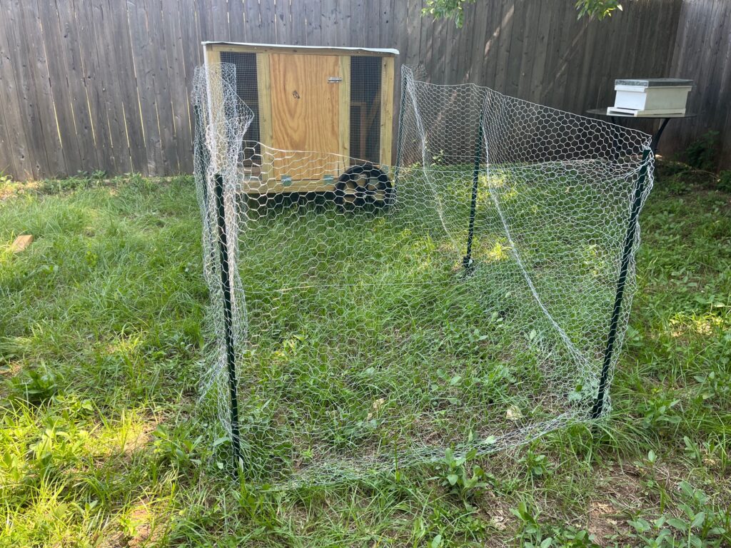 A chicken coop and fenced-in run.