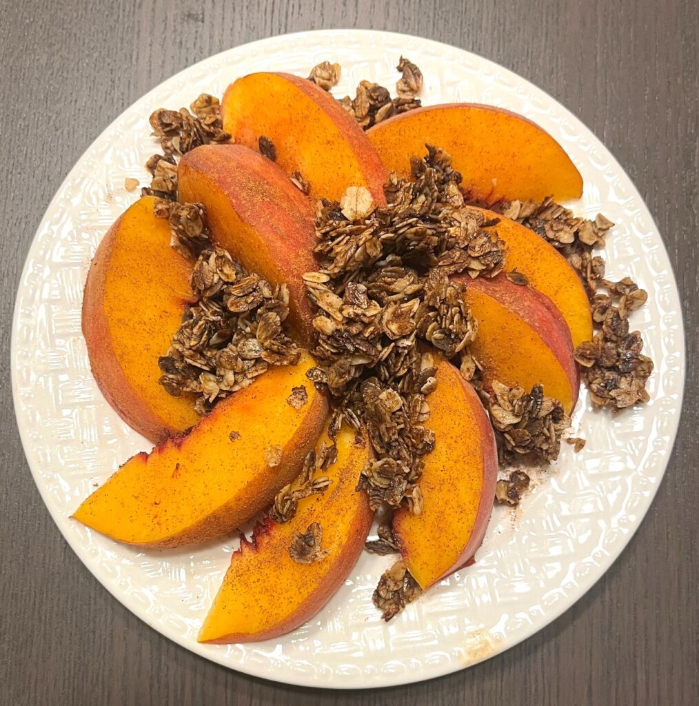 Peaches and granola on a plate