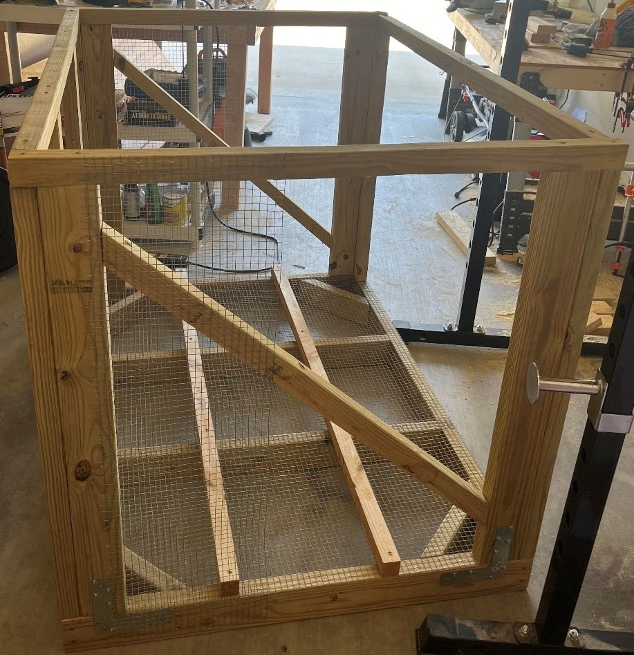 A wooden chicken coop frame